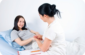 Nurse attending to a patient.